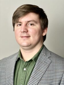 Portrait photo of Will Brown in a sport coat.